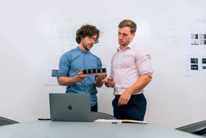 Two team members considering a product
