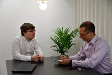 Luke discussing with JonO in meeting room