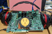 VPK120 development board pictured wearing ear defenders with silent smiley on the fan