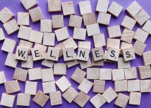 Wooden scrabble tiles spelling out the word wellness